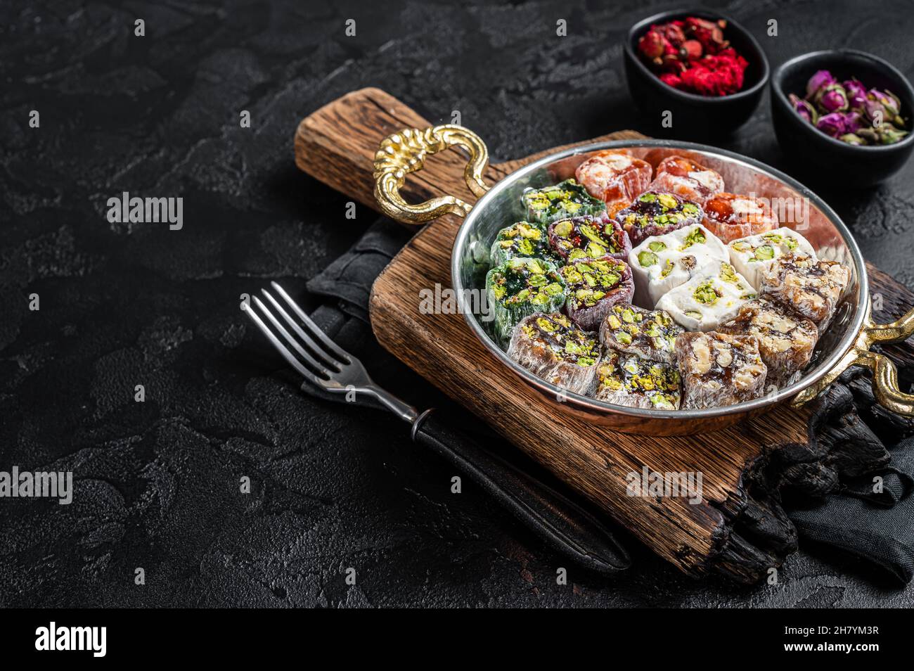 Turkish Delight Lukum, a national dessert. Black background. Top view. Copy space Stock Photo