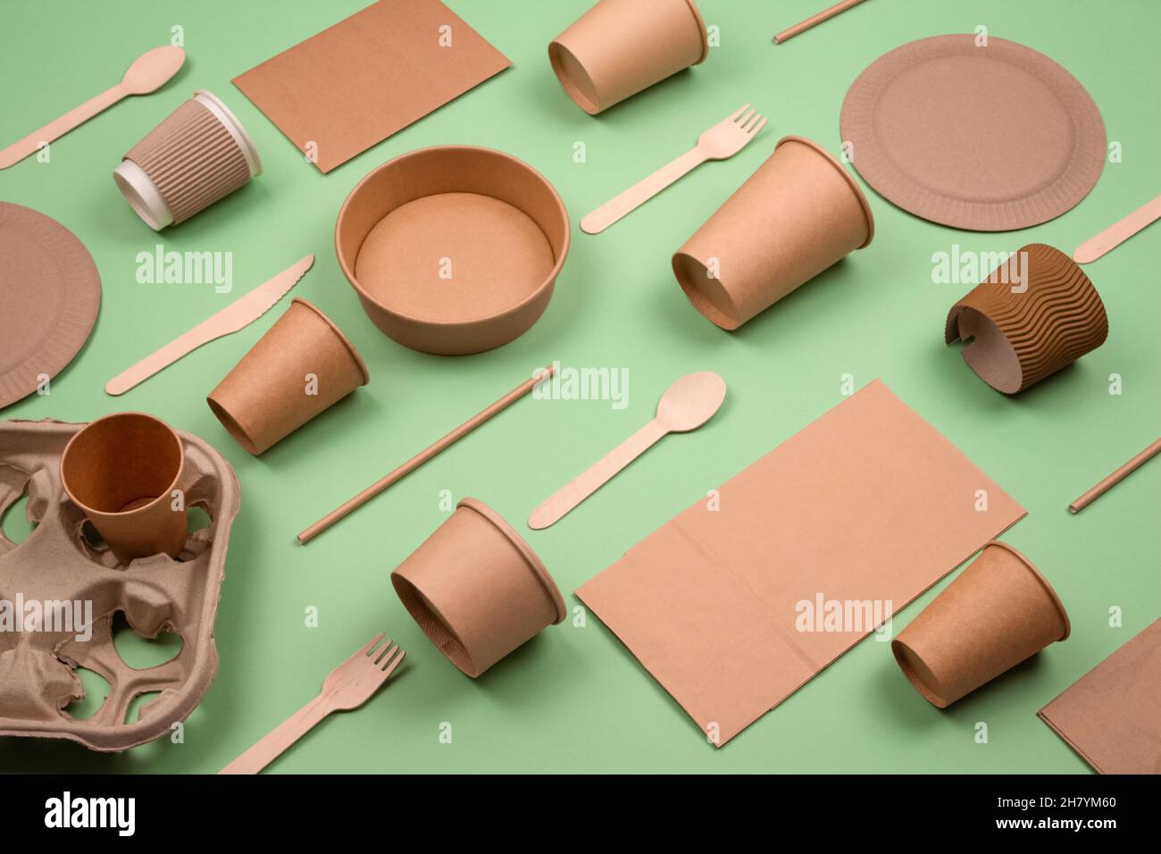 Set of different ecofriendly tableware and kraft paper food packaging