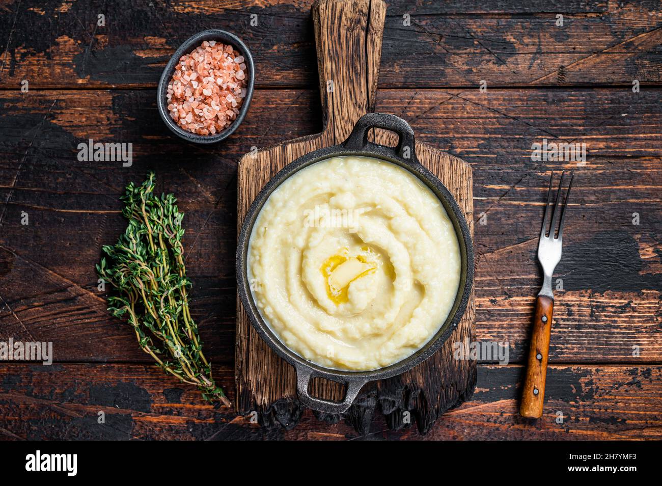 Mashed potatoes in a pan on wooden rustic table. Wooden background. Top view Stock Photo