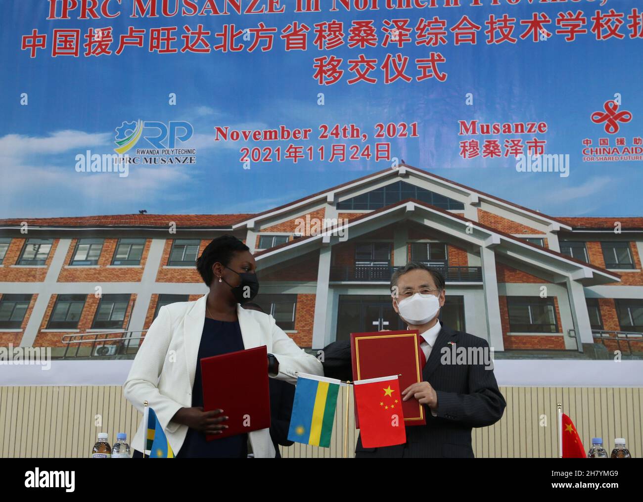Kigali, Rwanda. 24th Nov, 2021. Chinese Ambassador to Rwanda Rao Hongwei (R) and the Minister of State in Charge of ICT and TVET at Rwanda's Ministry of Education Claudette Irere attend a handover ceremony of the extension project of the Institute of Polytechnic Regional Centre (IPRC) Musanze campus in Musanze, Rwanda, Nov. 24, 2021. The extension project of the IPRC Musanze campus, in the Northern Province of Rwanda, has been completed after more than two years' construction and handed over to the Rwandan government. Credit: Ji Li/Xinhua/Alamy Live News Stock Photo