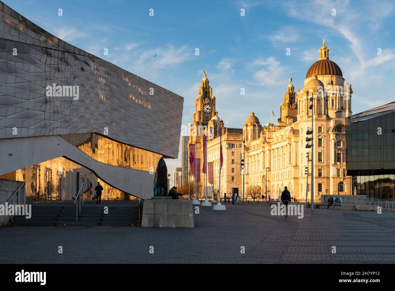 Liverpool waterfront - Pier Head, The Three Graces and Museum of Liverpool at sunset, Liverpool, England, UK Stock Photo