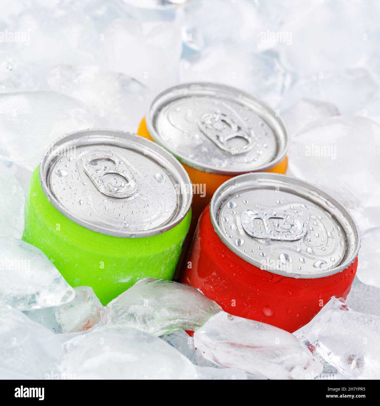 Drinks lemonade cola drink softdrinks in cans with ice cubes square soda Stock Photo