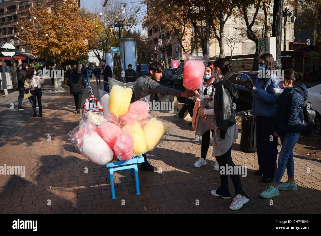 Jerewan, Armenia. 14th Nov, 2021. A vendor sells cotton candy to passersby downtown. Credit: Christian Charisius/dpa/Alamy Live News Stock Photo