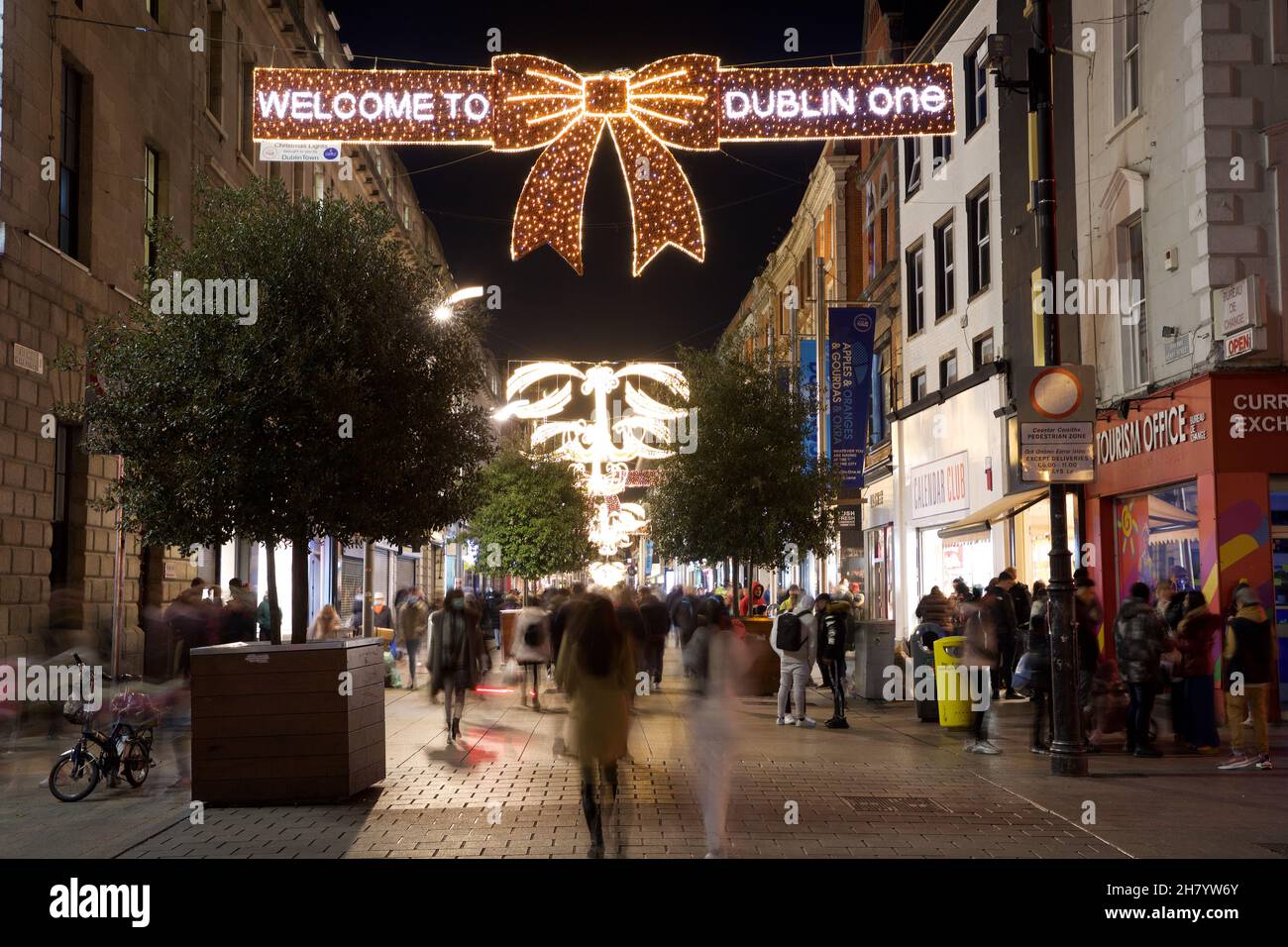 Dublin, Ireland - November 24, 2021: shoppers walk beneath the recently illuminated Christmas lights on Grafton Street, Dublin's main shopping thoroug Stock Photo