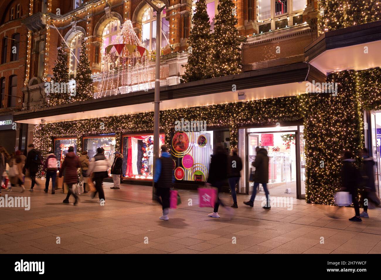 Dublin, Ireland - November 24, 2021: shoppers pass the Christmas lights and decorations at the landmark Arnotts Department Store on Henry Street, the Stock Photo