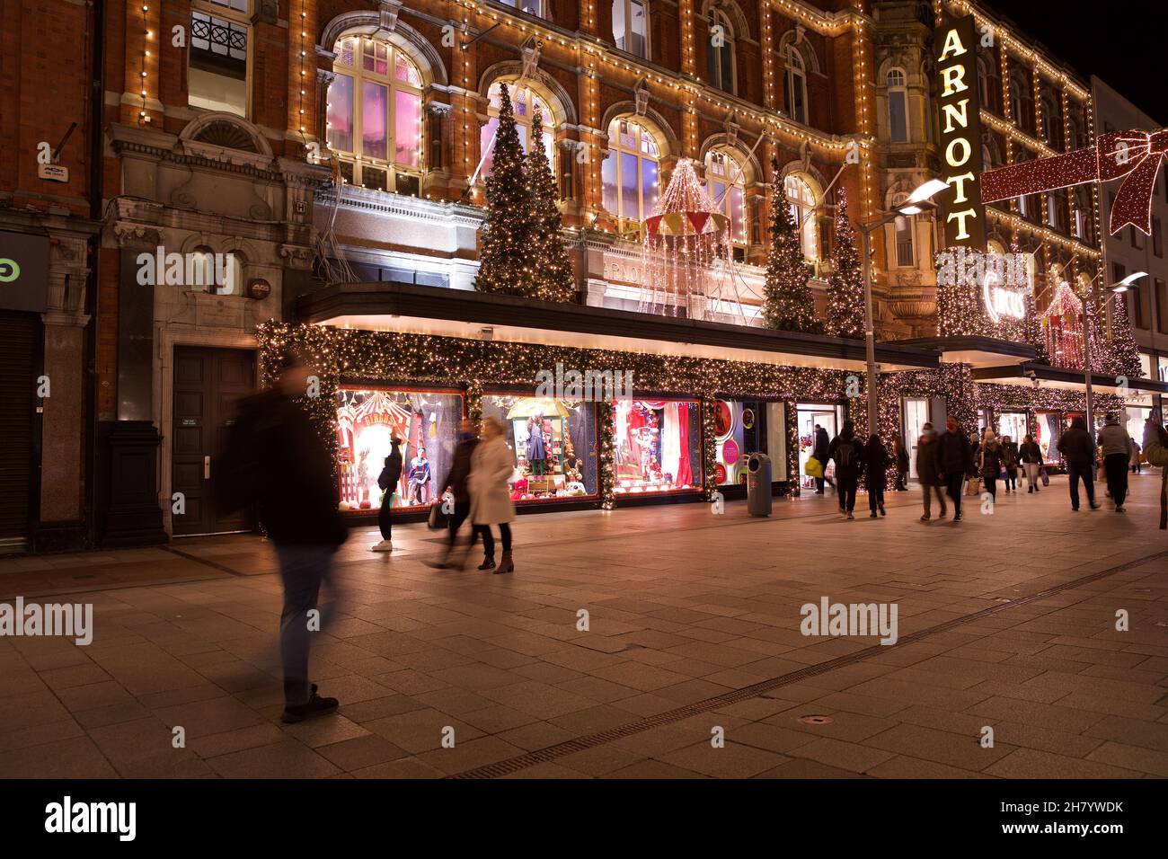 Dublin, Ireland - November 24, 2021: shoppers pass the Christmas lights and decorations at the landmark Arnotts Department Store on Henry Street, the Stock Photo