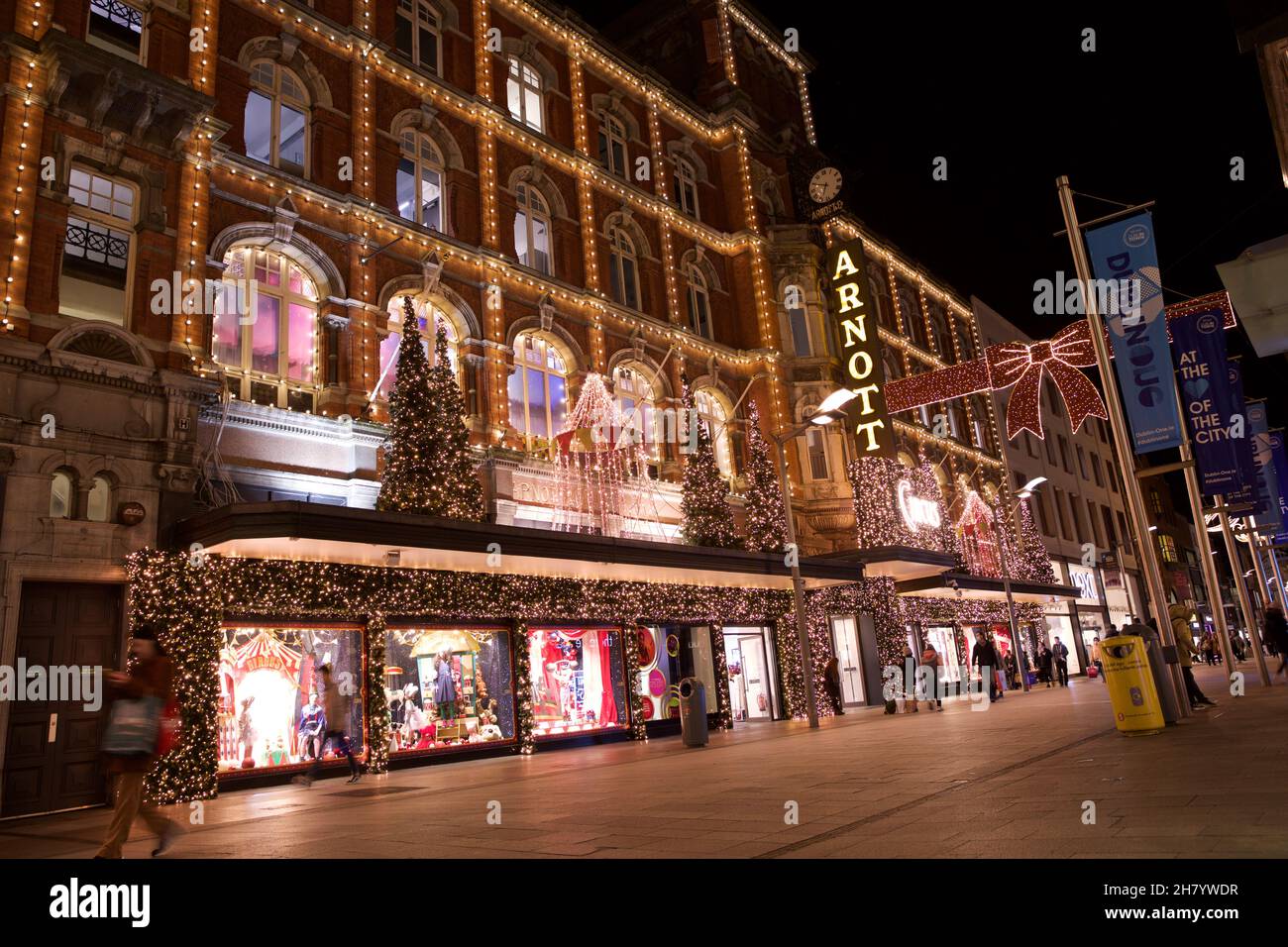 Dublin, Ireland - November 24, 2021: shoppers pass the Christmas lights and decorations at the landmark Arnotts Department Store on Henry Street, the Stock Photo