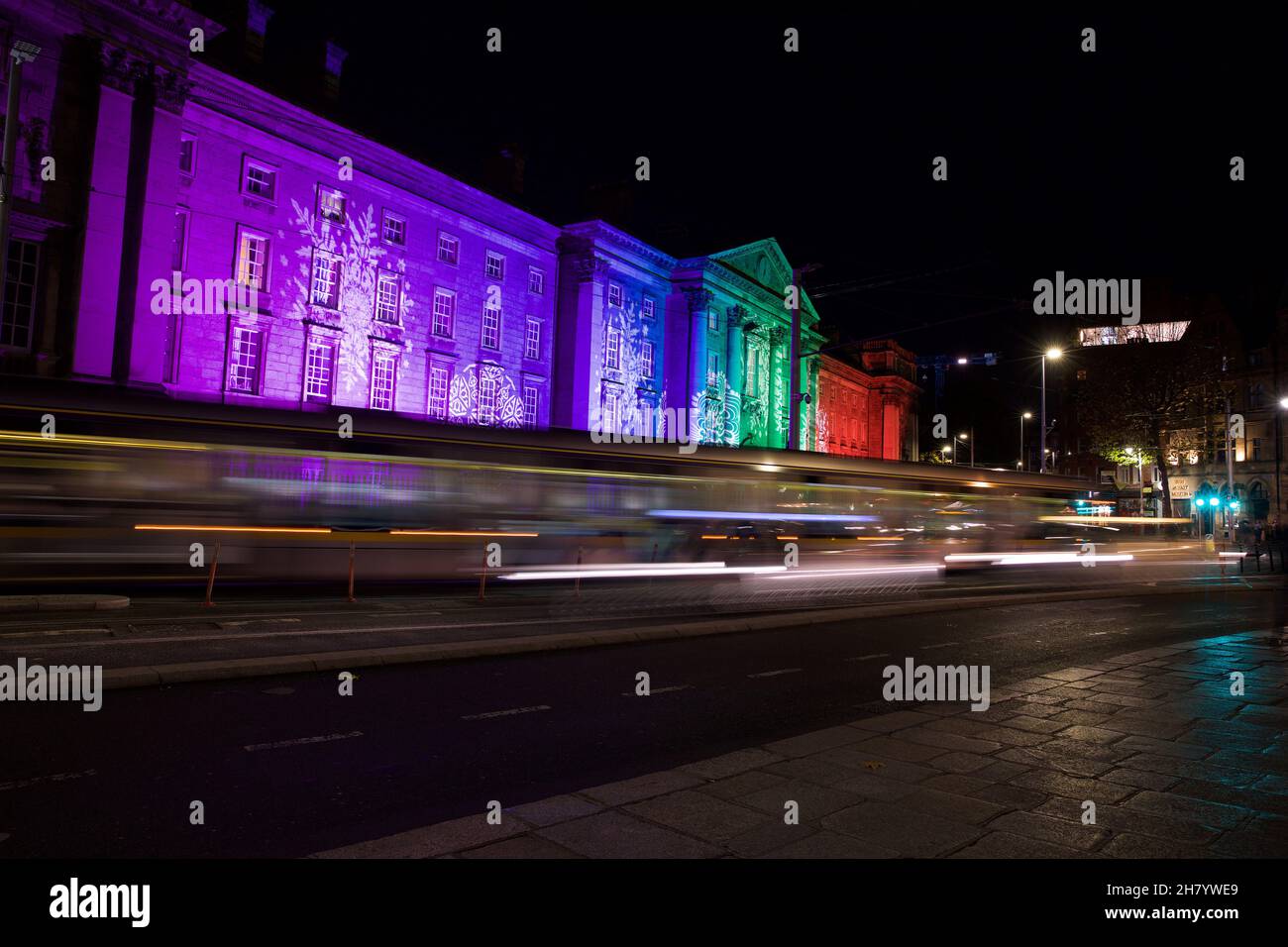 Dublin, Ireland - November 24, 2021: Trinity College Dublin on College Green illuminated with a festive Christmas light show and the light trails from Stock Photo