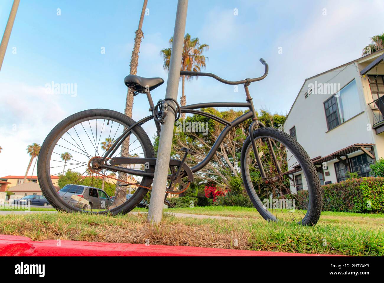 Bicycle locked on a metal pole at La Jolla, California Stock Photo