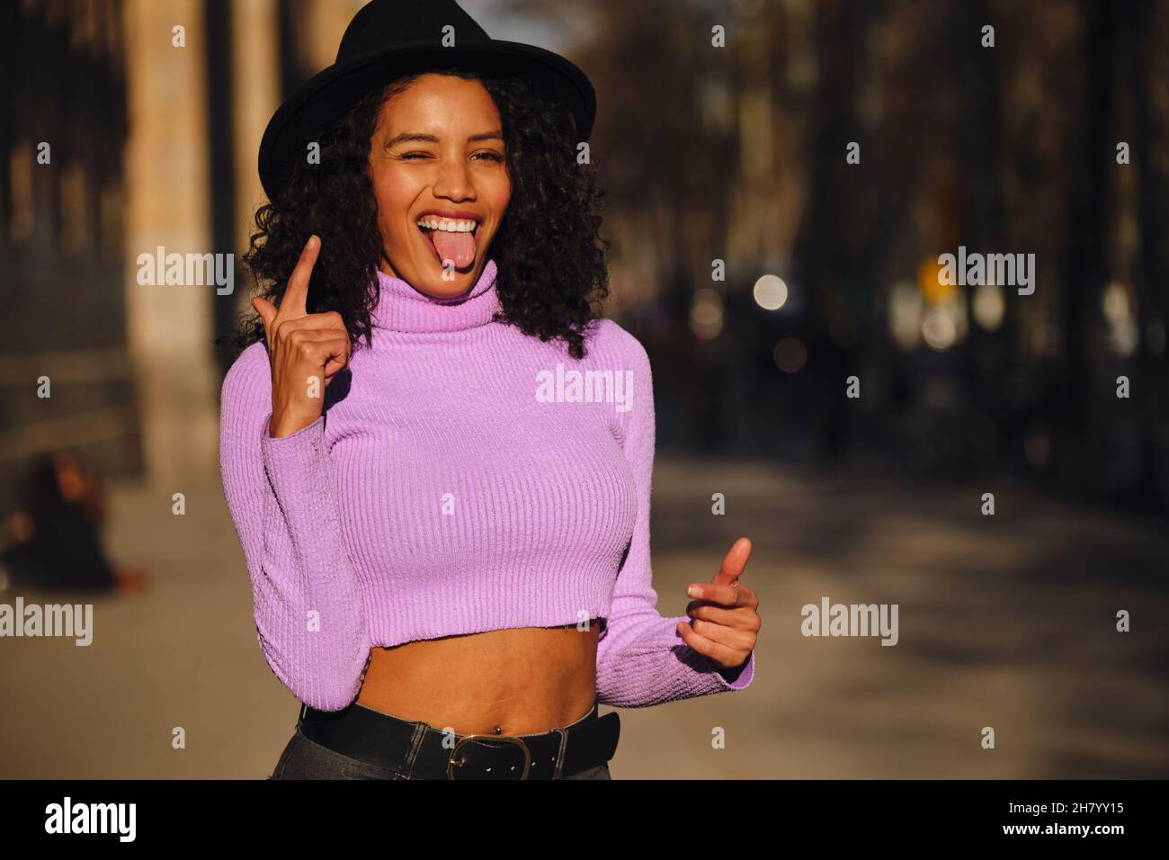 Happy young woman posing outdoors. Stock Photo