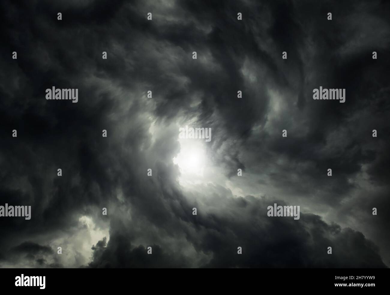 White Hole in the Whirlwind of the Dark Storm Clouds Stock Photo