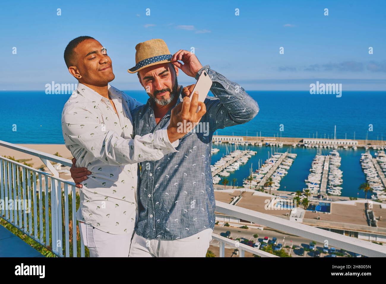 a gay couple using a mobile phone Stock Photo