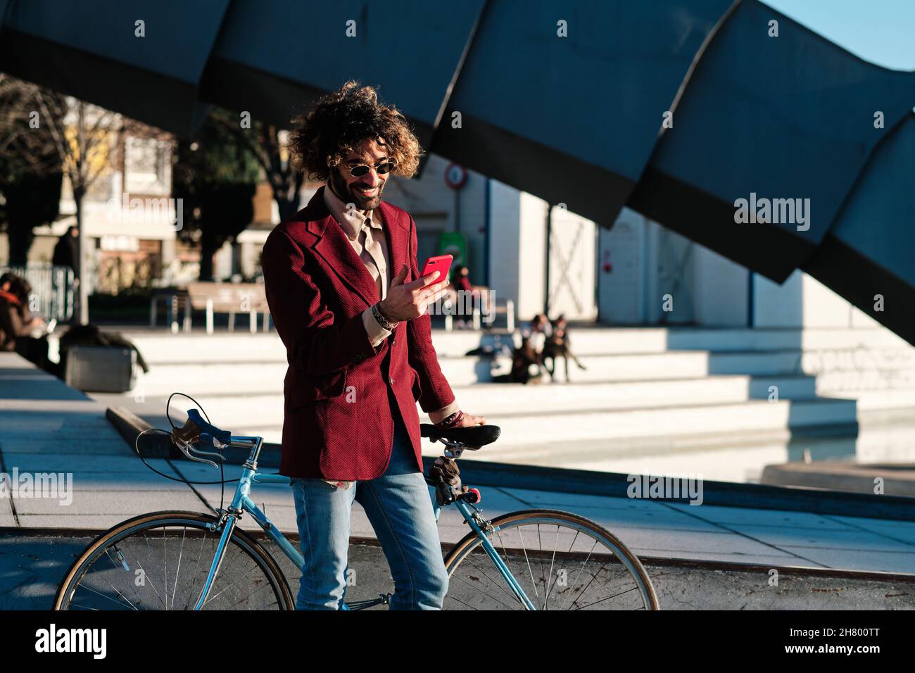 Man using his mobile phone outdoors. Stock Photo