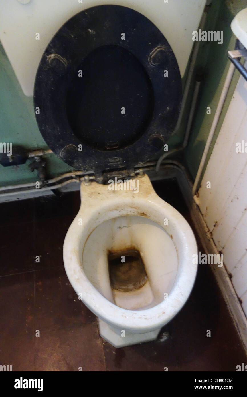 Filthy Dirty Toilet with Seat and Bowl in Public Bathrooms. Not been  cleaned Stock Photo - Alamy
