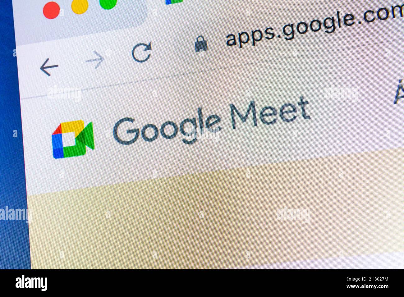 Close-up of Google Meet logo on computer screen in browser Stock Photo