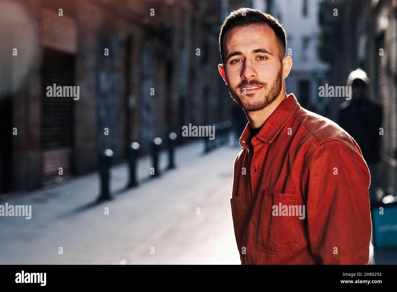 Man standing outdoors on the street. Stock Photo