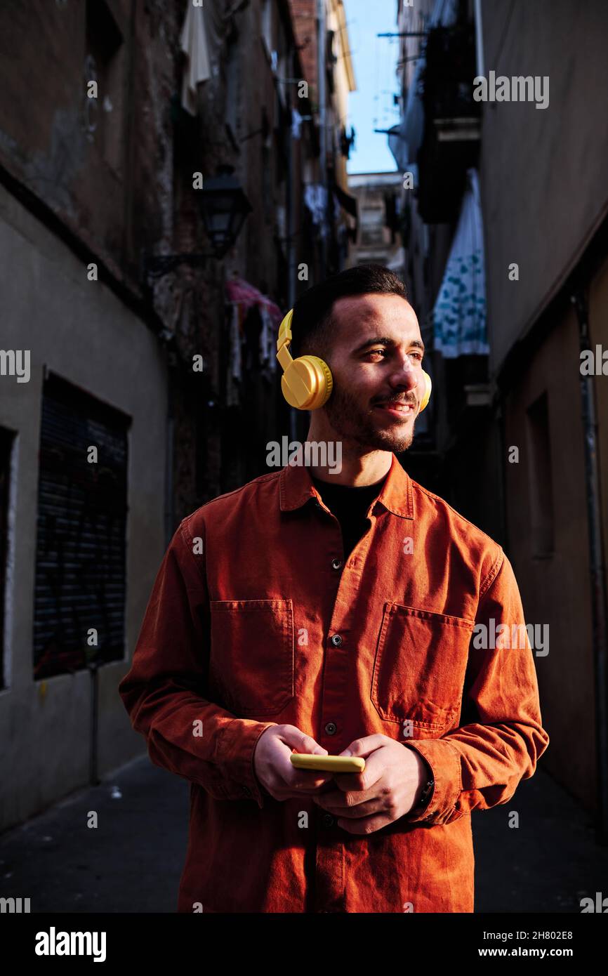Man using his phone while listening music. Stock Photo