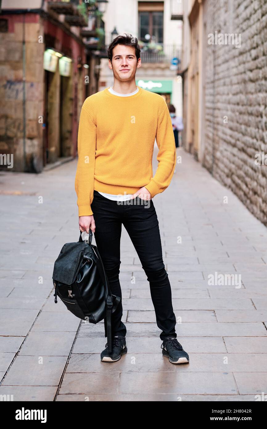 Portrait of young man standing outdoors on the street Stock Photo - Alamy