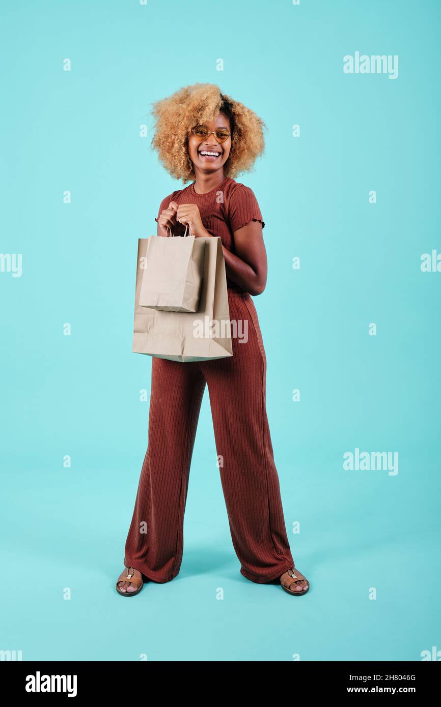 Excited black woman bags hi-res stock photography and images - Alamy