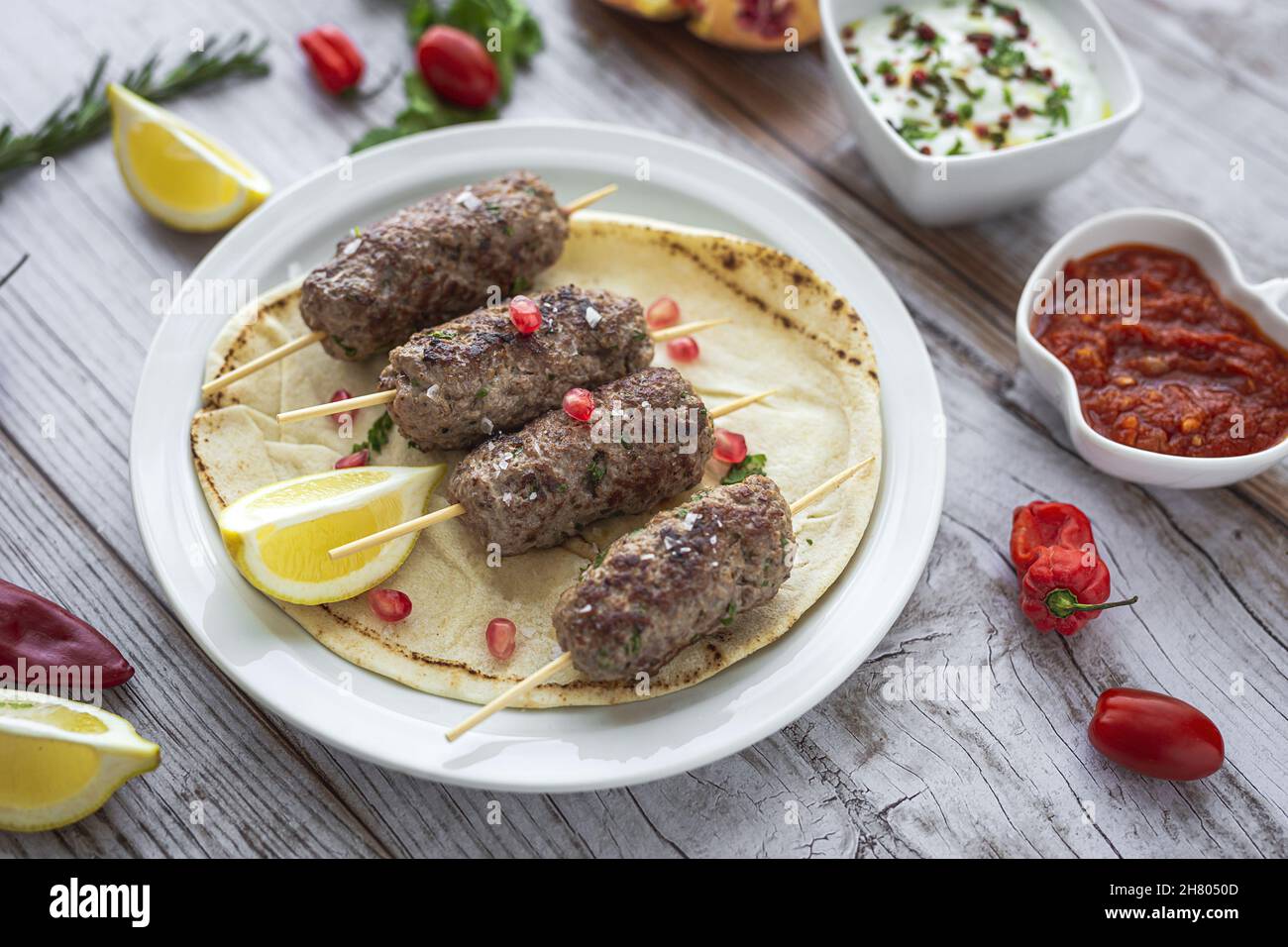 Traditional homemade kafta or kofta kebab beef and lamb with tomato