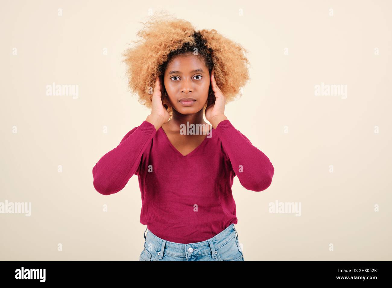 Serious black woman with afro hi-res stock photography and images - Alamy