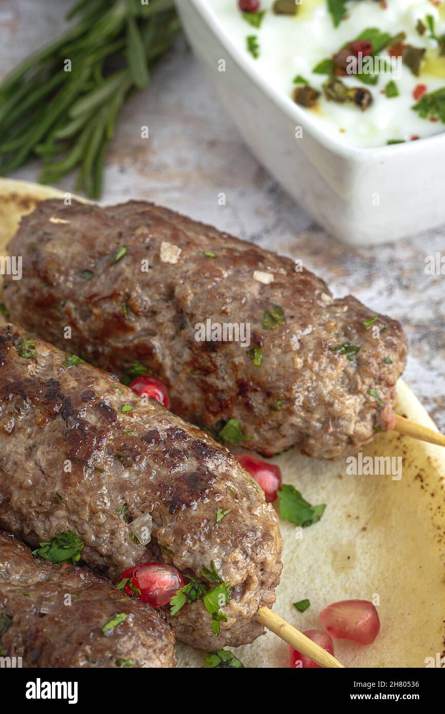 Traditional homemade kafta or kofta kebab beef and lamb with tomato