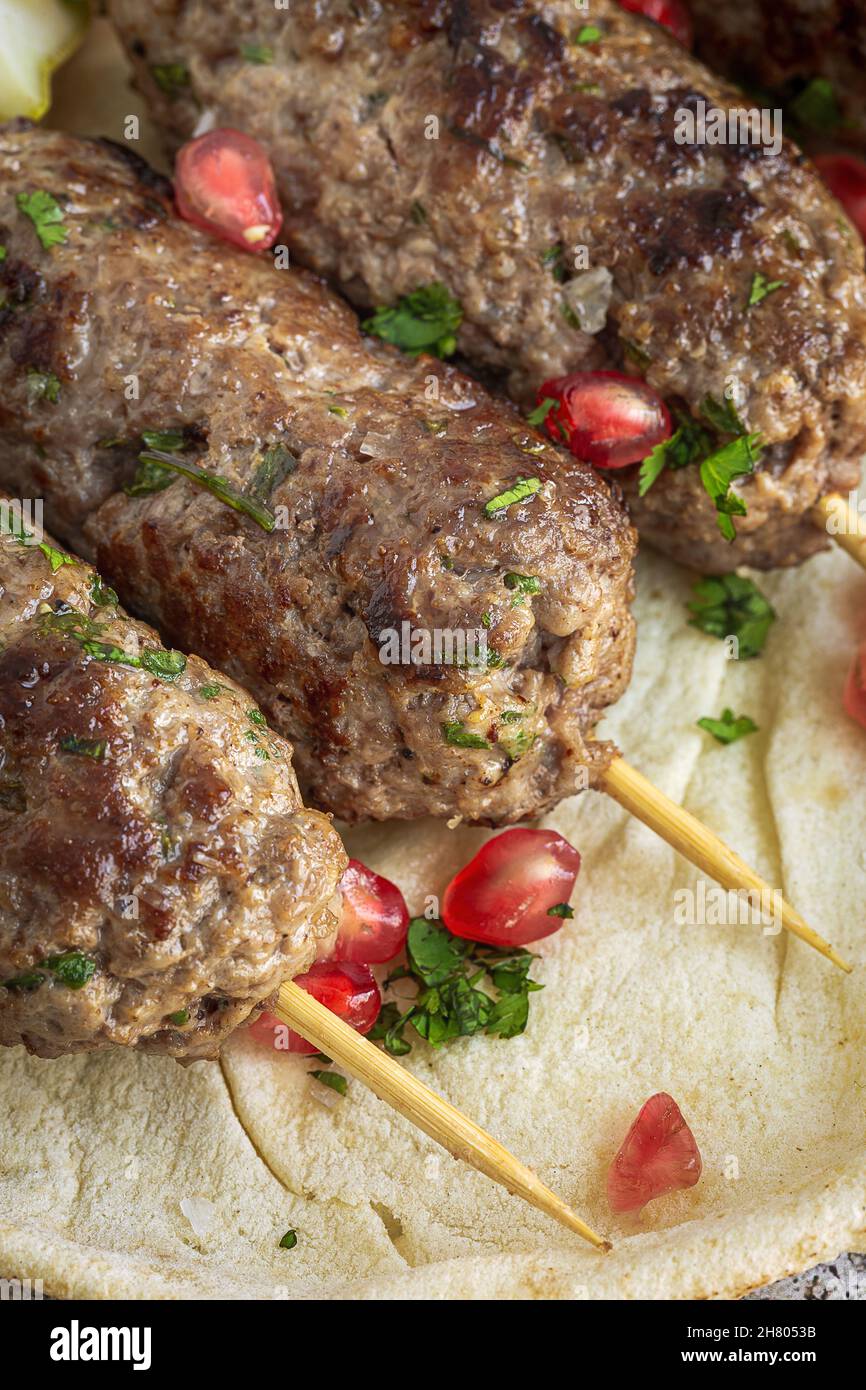 Traditional homemade kafta or kofta kebab beef and lamb with tomato