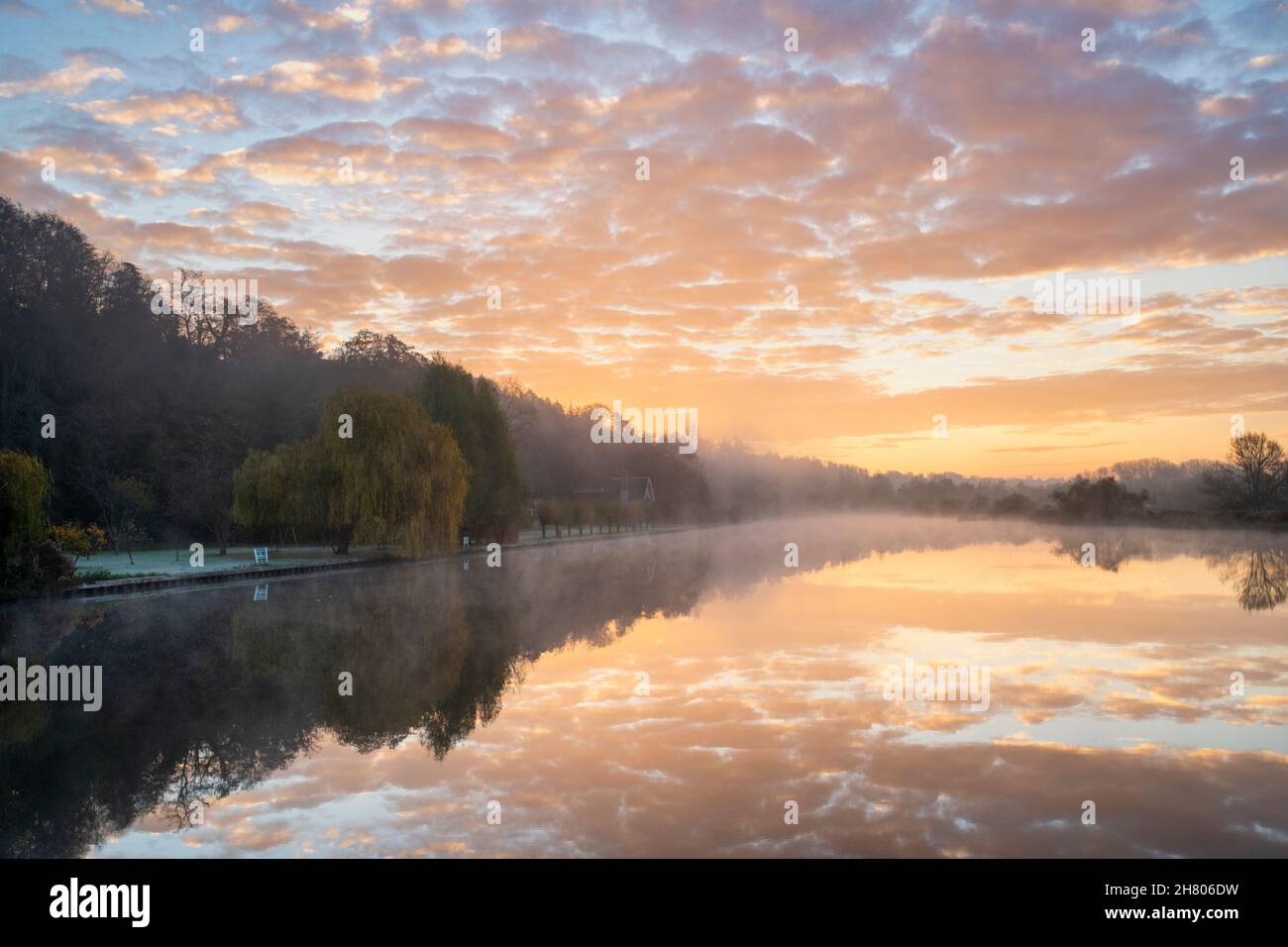 Misty sunrise and reflections along the River Thames. Henley-on-Thames, Berkshire / Oxfordshire, England Stock Photo
