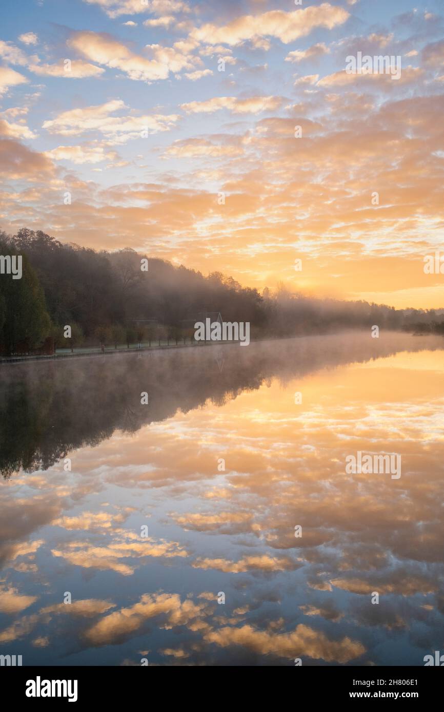Misty sunrise and reflections along the River Thames. Henley-on-Thames, Berkshire / Oxfordshire, England Stock Photo