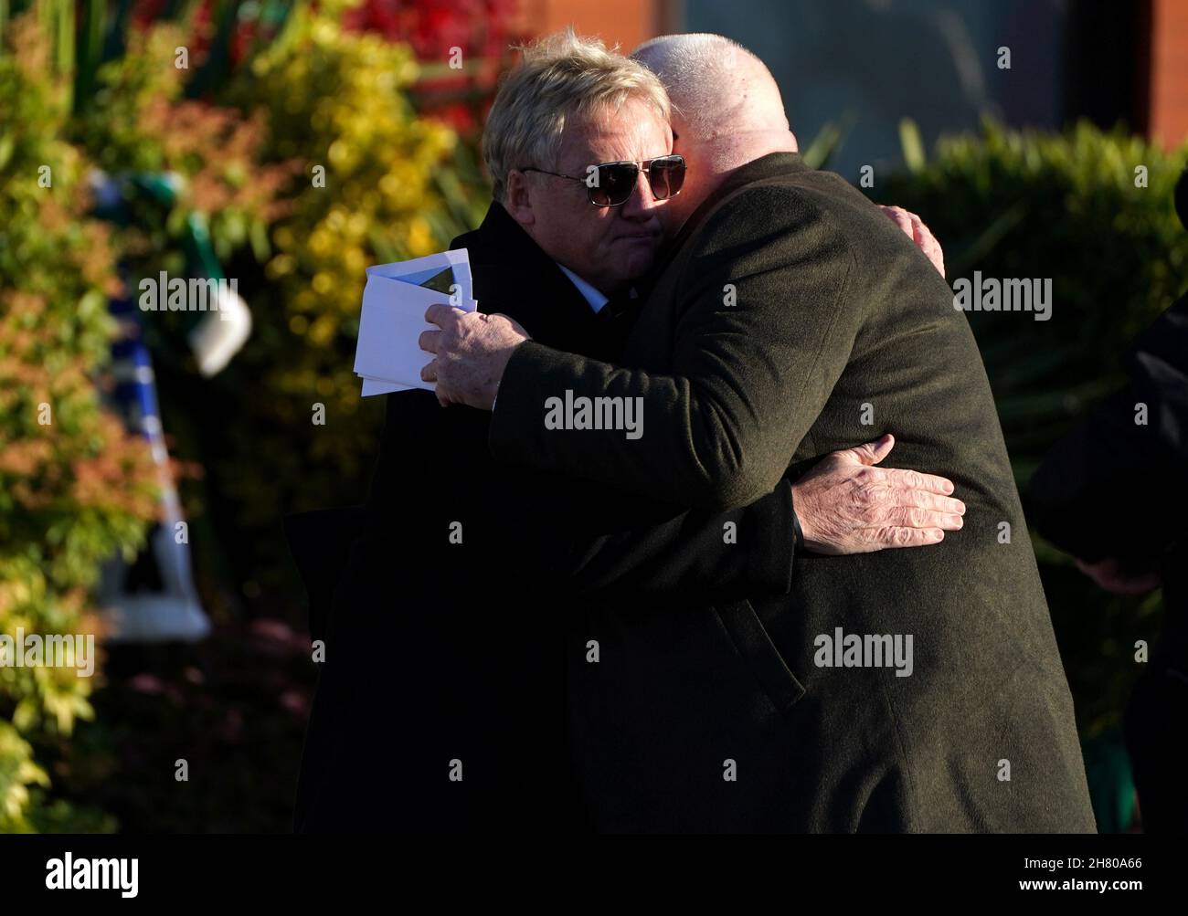 Frank McAvennie (left) ahead of  the funeral service of former Celtic player Bertie Auld. Auld, one of Celtic's European Cup heroes, died at the age of 83 on November 14, 2021. The midfielder scored 85 goals in 283 appearances over two spells for Celtic, the most famous game of which was the 1967 European Cup final win against Inter Milan in Lisbon. Picture date: Friday November 26, 2021. See PA story SOCCER Auld. Photo credit should read: Andrew Milligan/PA Wire. RESTRICTIONS: Use subject to restrictions. Editorial use only, no commercial use without prior consent from rights holder. Stock Photo