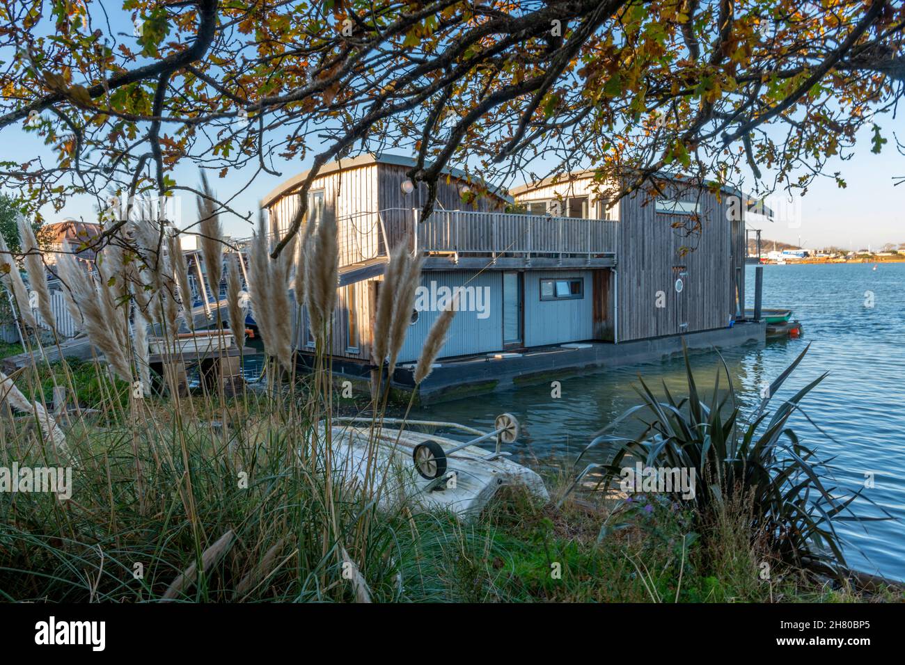 contemporary design houseboat on the coastline of the isle of wight at