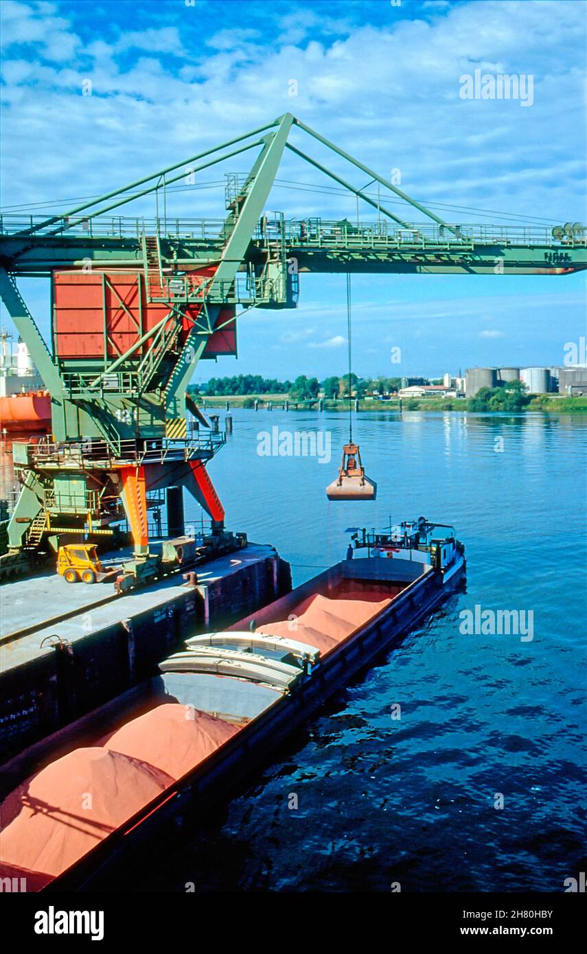 Potash fertilizer being loaded in the Port of Hamburg. Stock Photo