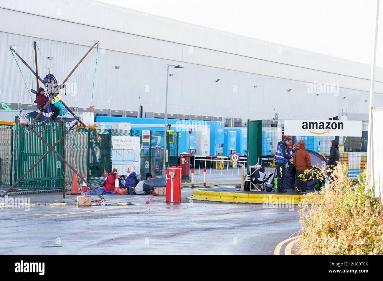 Activists from Extinction Rebellion block the entrance to the Amazon ...