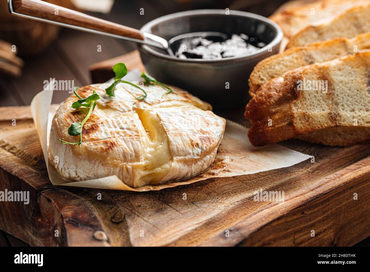 Baked camembert cheese appetizer with toasts Stock Photo Alamy
