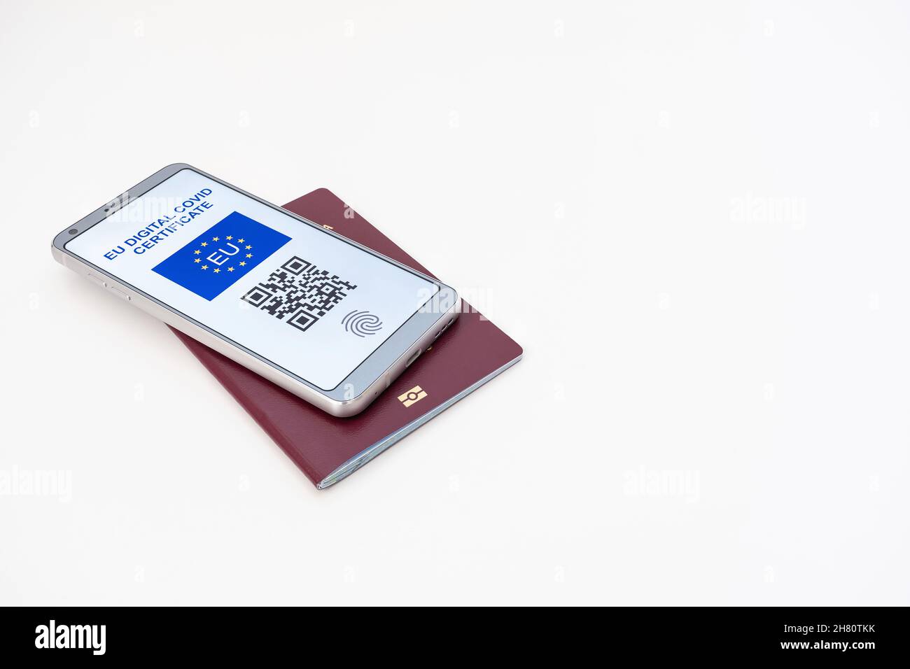 A smartphone with EU Greenpass digital covid certificate with dummy QR