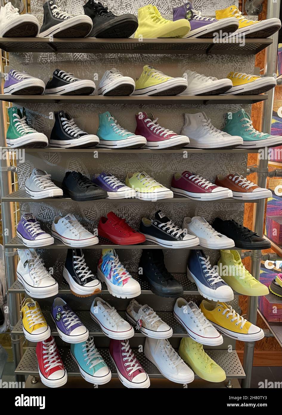FRESN, UNITED STATES - Oct 27, 2021: A vertical shot of a store wall shelf  full of Converse All-Star Canvas Shoes in different fun colors Stock Photo  - Alamy