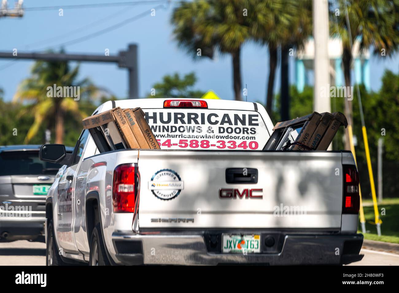 Hollywood, USA - July 8, 2021: Hurricane windows and doors advertisement sign on truck service business company to install shutters against storm in M Stock Photo