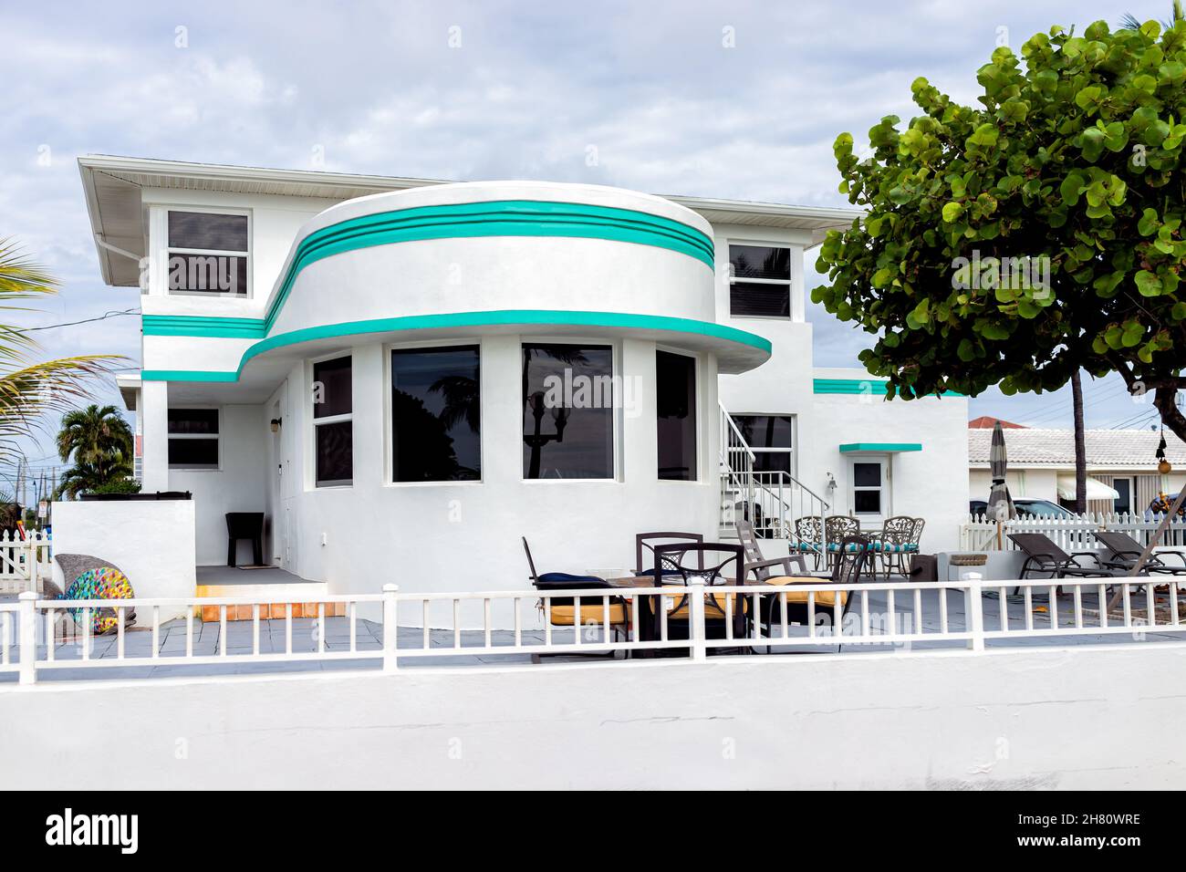 Hollywood, USA - August 4, 2021: North of Miami Beach, Hollywood broadwalk in Florida and art deco building with white and turquoise green blue archit Stock Photo