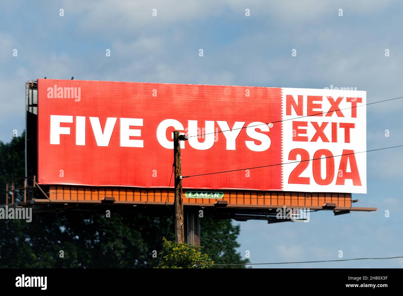 Johnson City, USA - June 23, 2021: Tennessee Johnson city with advertisement sign for Five Guys burger fast food restaurant on highway exit interstate Stock Photo