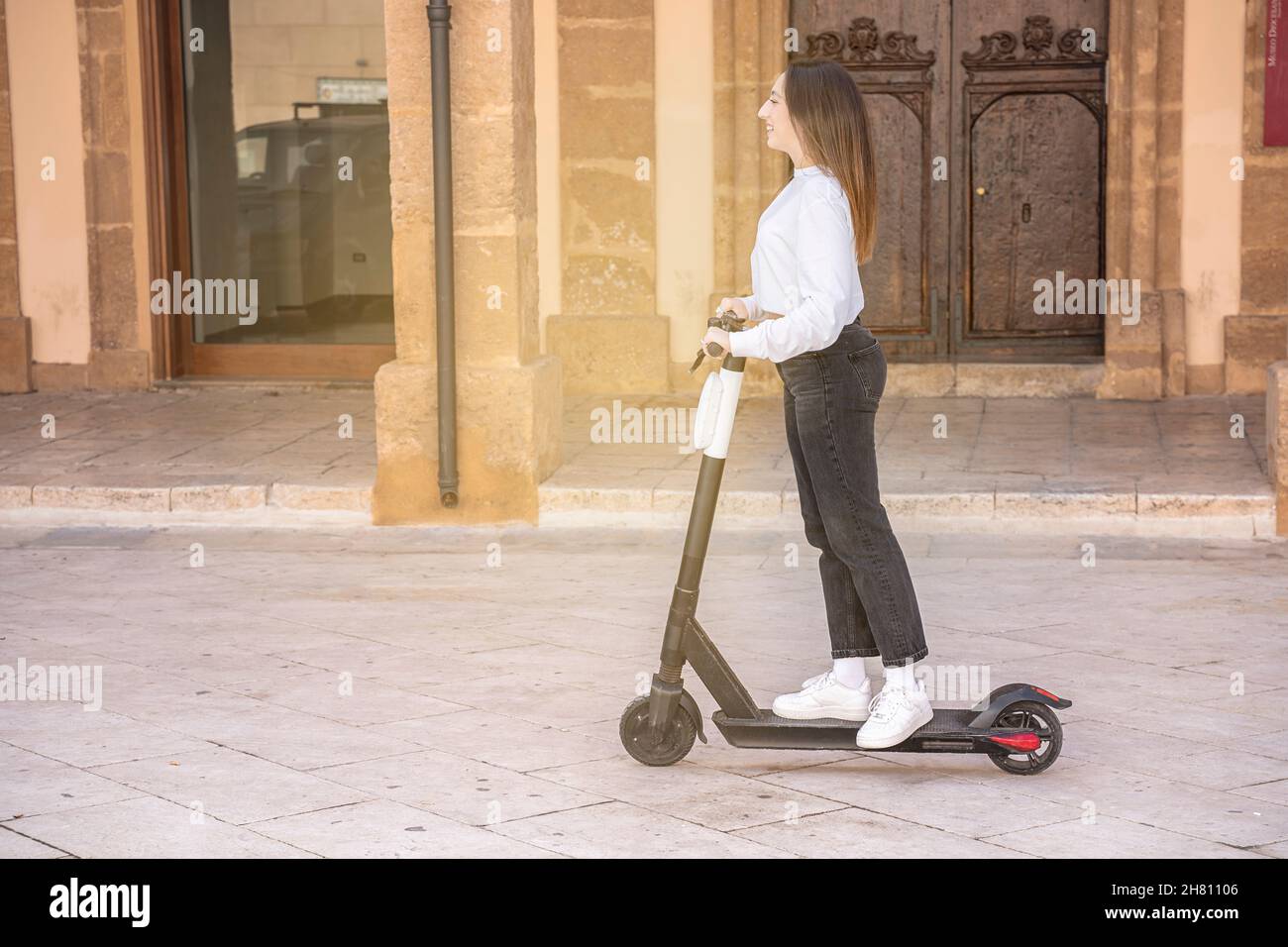 Woman riding scooter smile hi-res stock photography and images - Page 3 -  Alamy
