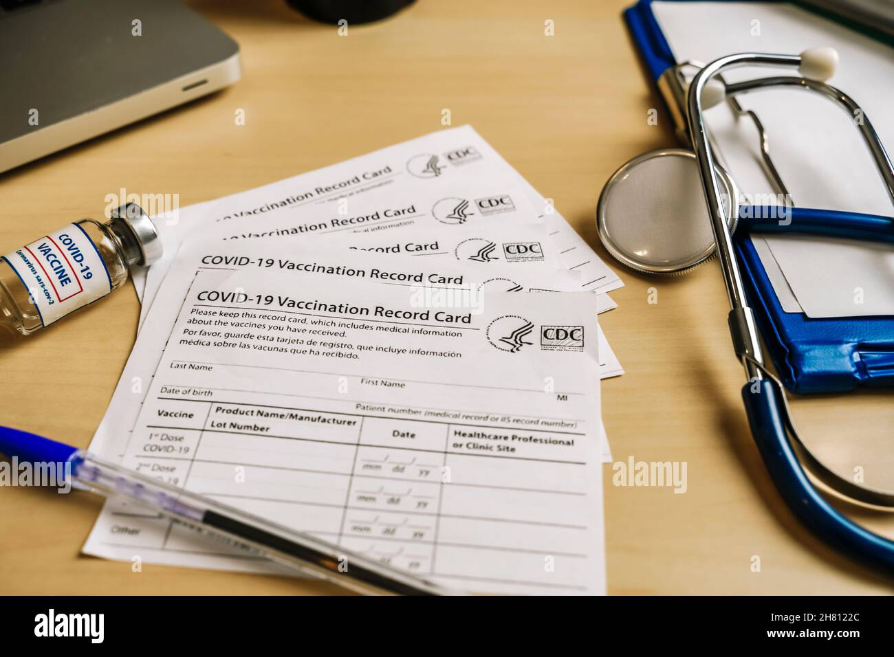 New York, USA - November 25 2021. Vaccination record card. Vaccination form during the coronavirus epidemic on the doctor's table in the hospital. . High quality photo Stock Photo
