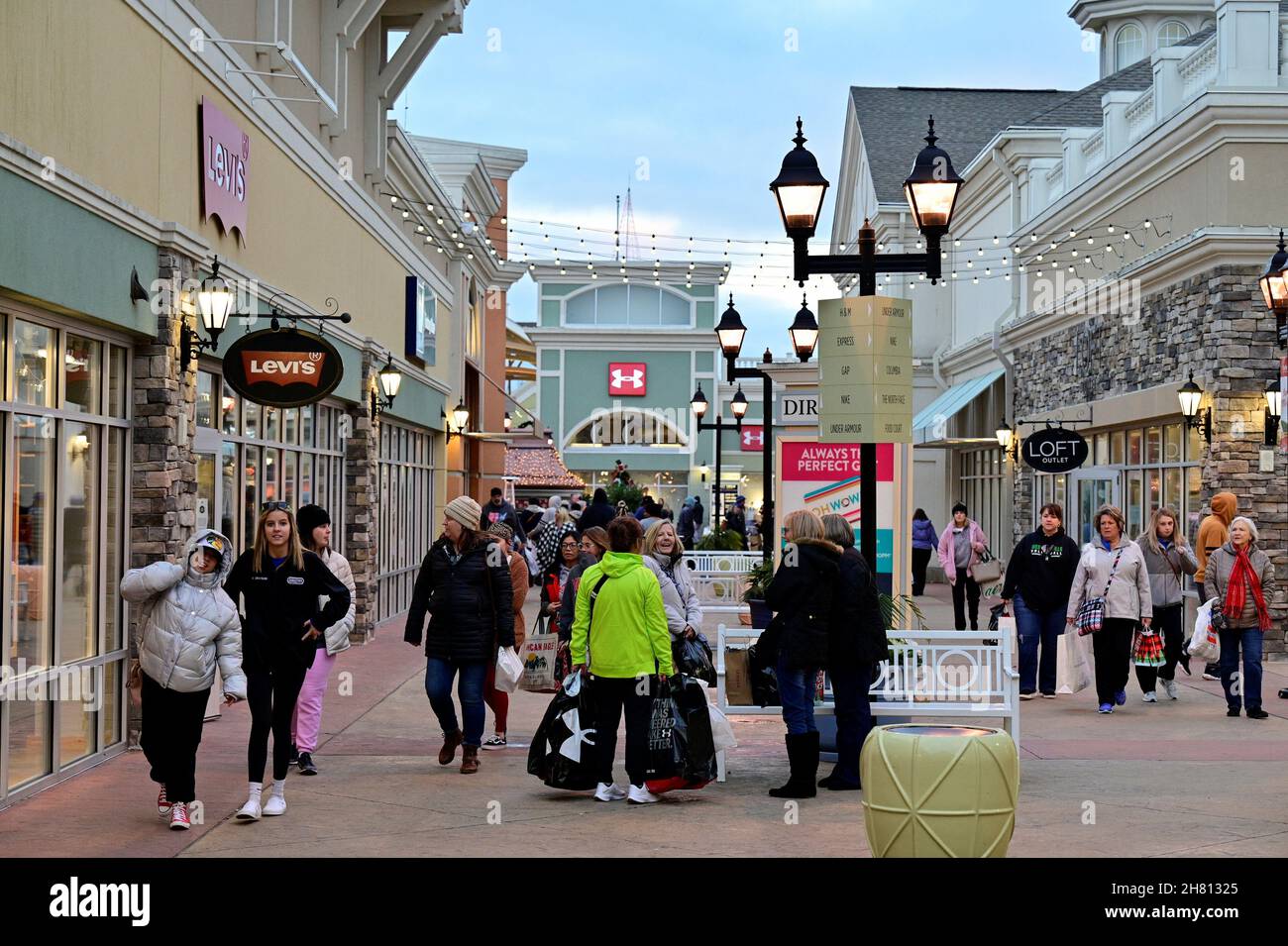 Shoppers walk around a shopping area as Black Friday sales begin at The  Outlet Shoppes of the Bluegrass in Simpsonville, Kentucky, U.S. November  26, 2021. REUTERS/Jon Cherry Stock Photo - Alamy