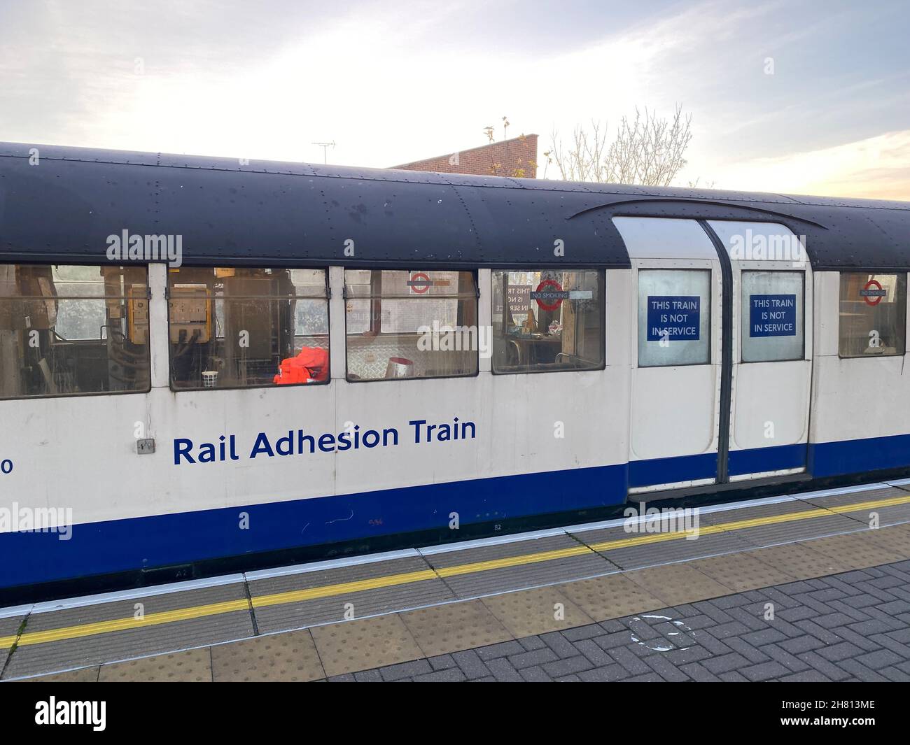 A Rail Adhesion Train running on the Central Line of the London Underground, near Ruislip Gardens. The train dispenses an adhesive material on to the rails to help the wheels on Tube trains grip the track during periods of leaf fall. Picture date: Thursday November 25, 2021. Stock Photo