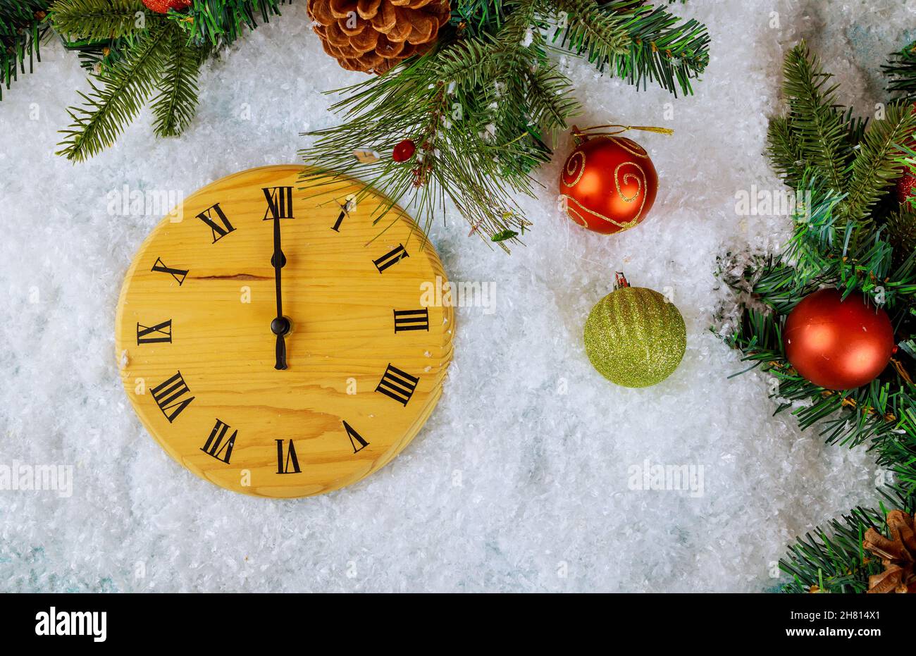 Christmas decorations tree with snow retro style clock to midnight Happy New Year Stock Photo