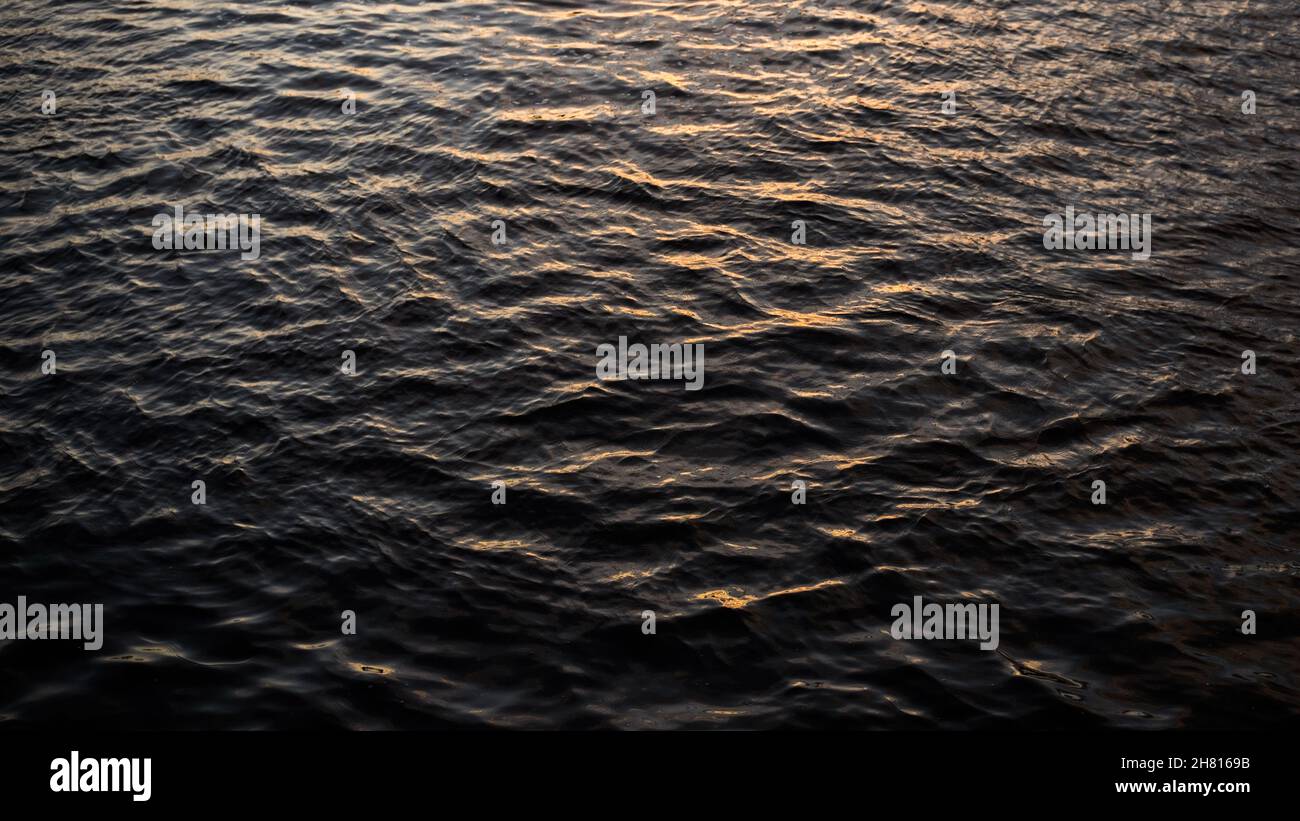 An abstract closeup of a shallow disturbance on water surface Stock Photo