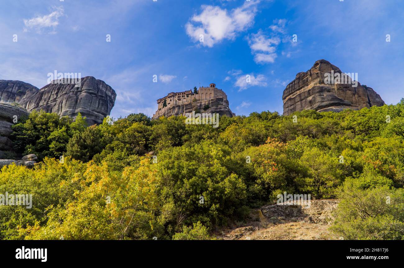 Panoramic sunset view of the Holy Monastery of Varlaam in Meteora, Thessaly, Greece built on unique rock formations Stock Photo