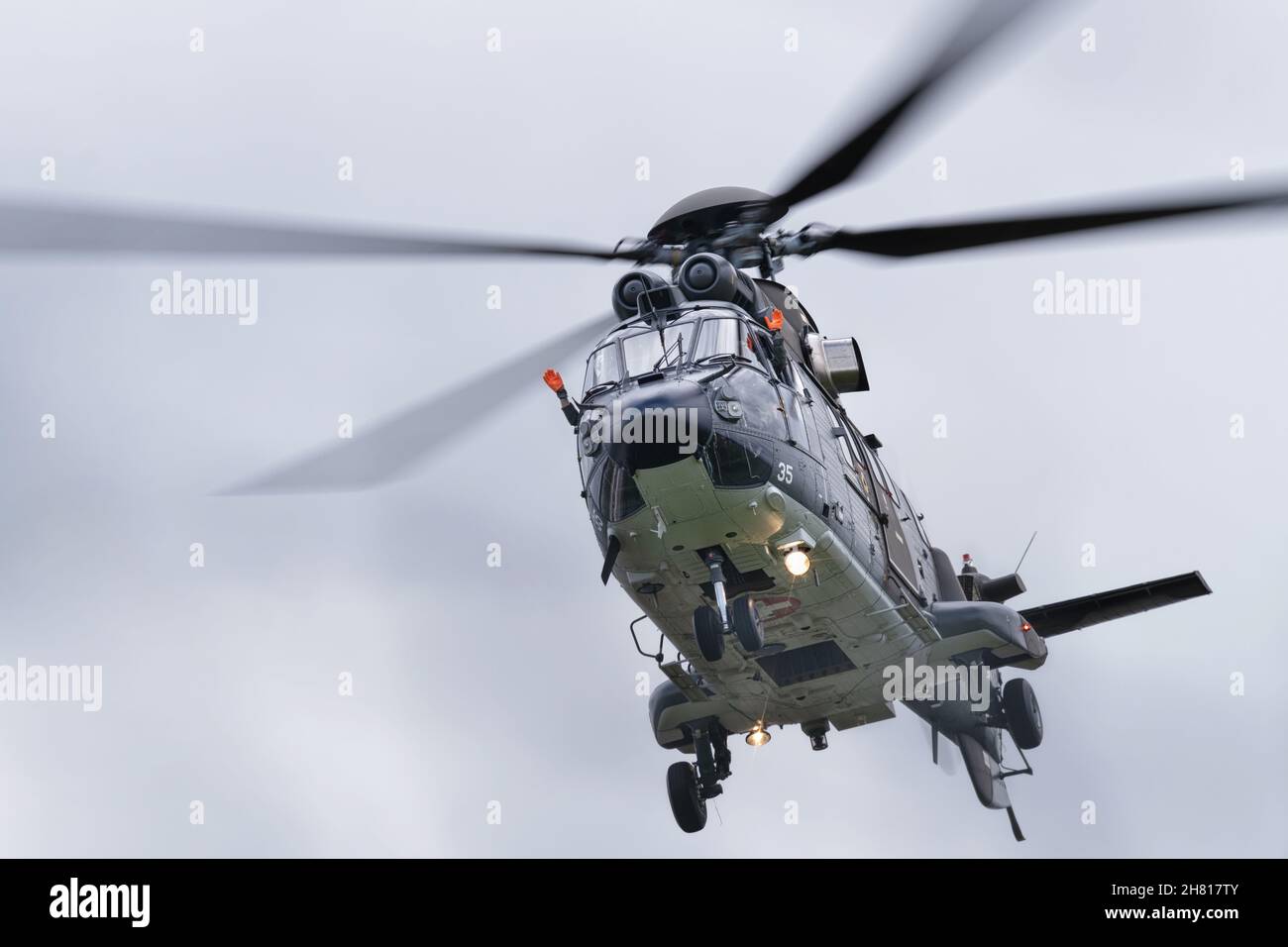 Eurocopter AS332 Super Puma also known as the Airbus Helicopter H215 during NATO Days 2021 in Ostrava, Czech republic. Both pilots are waving towards Stock Photo