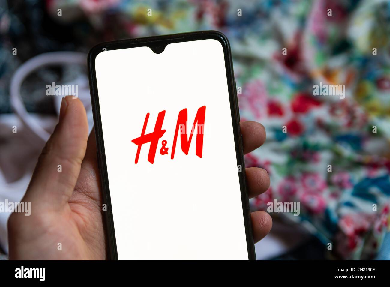 The fashion retailer H&M mobile app logo is seen on the screen of a mobile  phone in Barcelona, Spain on November 26, 2021. Online shopping is very  popular among millennials and constantly
