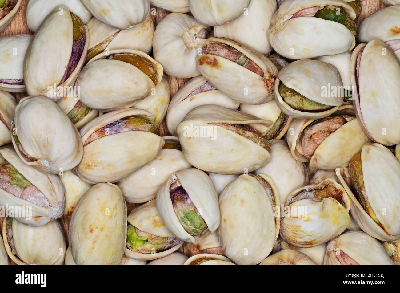 Roasted and salted pistachios in shell (texture, background Stock Photo ...