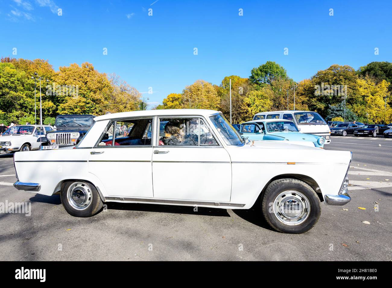 Bucharest, Romania, 24 October 2021: One white Lada vintage car in traffic in a street at an event for vintage cars collections, in a sunny autumn day Stock Photo